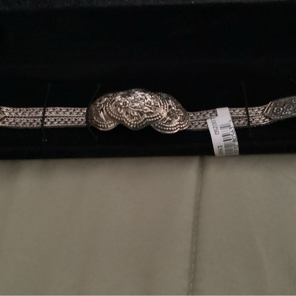 A beautiful 925 SS bracelet made in Thailand with a floral design.